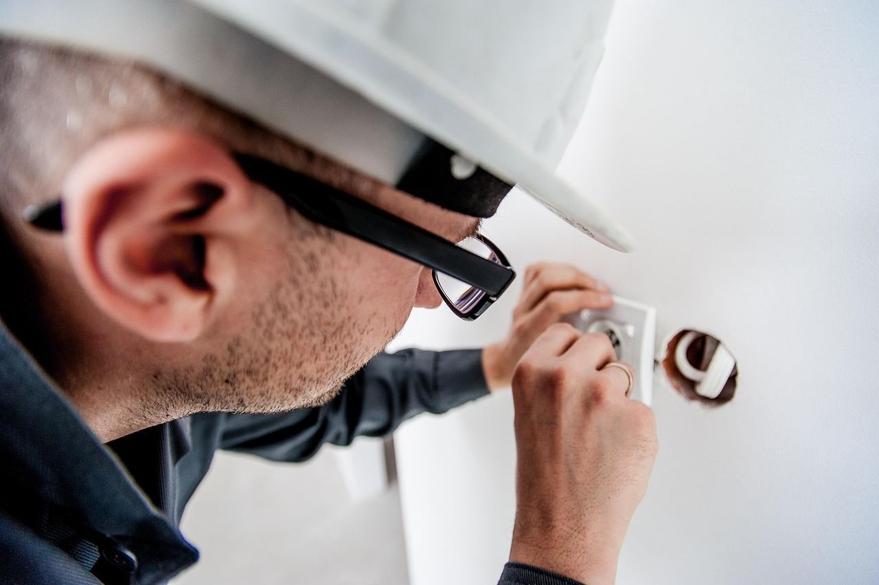 HVAC technician discussing a service plan (technician shown for reference)